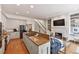Gourmet kitchen with island, hardwood floors, stainless appliances, and adjacent Gathering room at 3131 Nw Slaton Nw Dr # 24, Atlanta, GA 30305
