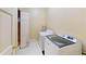 Bright laundry room featuring a new, white, front-loading washer and dryer at 3131 Nw Slaton Nw Dr # 24, Atlanta, GA 30305