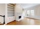 Bright living room with fireplace, built-in bookcases, and french doors at 3131 Nw Slaton Nw Dr # 24, Atlanta, GA 30305