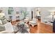 Elegant living room with hardwood floors, large windows, and stylish zebra print rug at 3131 Nw Slaton Nw Dr # 24, Atlanta, GA 30305