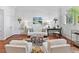 Bright living room features a decorative fireplace, ample seating, and a large window at 3131 Nw Slaton Nw Dr # 24, Atlanta, GA 30305