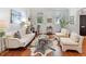 Inviting living room showcasing hardwood floors, a unique rug, and ample natural light at 3131 Nw Slaton Nw Dr # 24, Atlanta, GA 30305