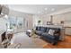 Open-concept living space with a fireplace, patio access, and seamless flow to the kitchen at 3131 Nw Slaton Nw Dr # 24, Atlanta, GA 30305