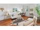 Elegant living room featuring hardwood floors, a decorative rug, and stylish furnishings at 3131 Nw Slaton Nw Dr # 24, Atlanta, GA 30305