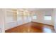 Office room with natural light, hardwood floors, and custom built-in shelving at 3131 Nw Slaton Nw Dr # 24, Atlanta, GA 30305