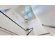 Grand staircase with white railing, hardwood steps and elegant lighting at 3131 Nw Slaton Nw Dr # 24, Atlanta, GA 30305