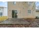 Backyard patio and home exterior with siding at 821 Stonebridge Park Cir, Lithonia, GA 30058