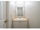 This bathroom features a single sink and a nice sized mirror at 821 Stonebridge Park Cir, Lithonia, GA 30058