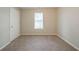 Inviting bedroom featuring neutral walls and carpeting at 821 Stonebridge Park Cir, Lithonia, GA 30058