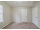 Bedroom with two doors, carpet, and natural light at 821 Stonebridge Park Cir, Lithonia, GA 30058