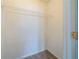 A simple closet with a shelf for storage at 821 Stonebridge Park Cir, Lithonia, GA 30058