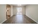Open dining room with hardwood floors and sliding glass door leading to the backyard at 821 Stonebridge Park Cir, Lithonia, GA 30058