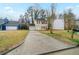 Charming two-story home featuring a classic design, single car garage, and long driveway at 821 Stonebridge Park Cir, Lithonia, GA 30058