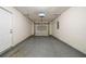An empty two car garage ready for vehicles and storage at 821 Stonebridge Park Cir, Lithonia, GA 30058