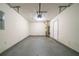 Empty garage with a white door and overhead lighting at 821 Stonebridge Park Cir, Lithonia, GA 30058