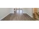 Hardwood hallway showing transition into the kitchen area with checkerboard flooring at 821 Stonebridge Park Cir, Lithonia, GA 30058
