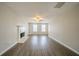 Inviting living room featuring hardwood floors, a fireplace, and plenty of natural light at 821 Stonebridge Park Cir, Lithonia, GA 30058