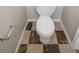 The toilet sits on the checkered tile of this bathroom at 821 Stonebridge Park Cir, Lithonia, GA 30058