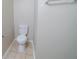 Toilet and towel rack in a simply decorated bathroom at 821 Stonebridge Park Cir, Lithonia, GA 30058