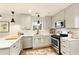 Bright kitchen with modern appliances, white cabinets, quartz countertops, and hardwood floors at 1840 Se Terry Mill Se Rd, Atlanta, GA 30316