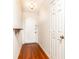 Entryway featuring hardwood floors, a white front door, and a decorative shelf at 2901 Lenox Ne Way # 902, Atlanta, GA 30324
