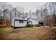 Inviting single-story house showing modern black garage door and trimmed landscaping in a lovely setting at 656 Hillwood Ct, Dacula, GA 30019