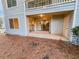 Patio area with sliding glass doors leading inside and natural pine straw ground cover at 17 Matawan Se Cir, Smyrna, GA 30080