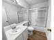 Bathroom with glass enclosed shower, white fixtures and tile flooring at 17 Matawan Se Cir, Smyrna, GA 30080