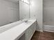 Bright bathroom features a large mirror and modern sink with a white countertop and cabinet at 17 Matawan Se Cir, Smyrna, GA 30080