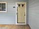 Exterior entry showing door with unit number and a side window, trimmed in white at 17 Matawan Se Cir, Smyrna, GA 30080