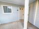Exterior entry featuring front door with sidelight and window with gray siding at 17 Matawan Se Cir, Smyrna, GA 30080