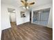 Bright living room with ceiling fan, wood-look floors, and sliding glass doors to patio at 17 Matawan Se Cir, Smyrna, GA 30080