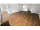 Open-concept living room boasts wood laminate flooring and abundant natural light at 17 Matawan Se Cir, Smyrna, GA 30080
