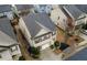 Aerial view of a two-story home with a dark roof, red shutters and a two-car garage at 5223 Catrina Way, Buford, GA 30519