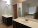 Bathroom with double vanity, large mirror, soaking tub, and a separate shower at 5223 Catrina Way, Buford, GA 30519