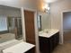 Well-lit bathroom with double sinks, walk-in shower, soaking tub, and neutral decor at 5223 Catrina Way, Buford, GA 30519
