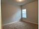 Bedroom featuring a large window and neutral carpet at 5223 Catrina Way, Buford, GA 30519