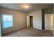 Carpeted bedroom with a window and closet at 5223 Catrina Way, Buford, GA 30519