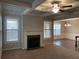 Inviting living room features a fireplace, large windows, and decorative moldings at 5223 Catrina Way, Buford, GA 30519