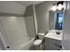 Bright bathroom featuring combination tub and shower, light gray vanity at 117 Legends Way, Hiram, GA 30141