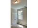 Bedroom featuring a large window and a closet with double doors at 117 Legends Way, Hiram, GA 30141