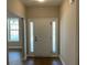 Bright entryway featuring natural light and a beautifully designed front door with sidelights at 117 Legends Way, Hiram, GA 30141