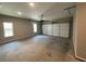 Spacious garage with a window and a white garage door at 117 Legends Way, Hiram, GA 30141