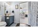 Updated bathroom with elegant fixtures and a view to the Primary bedroom at 2832 Old Villa Rica Rd, Powder Springs, GA 30127