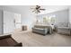 Bedroom with neutral walls, carpet, ceiling fan, and natural light from the windows at 2832 Old Villa Rica Rd, Powder Springs, GA 30127