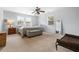 Bedroom with neutral walls, carpet, ceiling fan, and natural light from the windows at 2832 Old Villa Rica Rd, Powder Springs, GA 30127