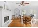 Bright dining room with hardwood floors, a fireplace and unique leaded glass window details at 2832 Old Villa Rica Rd, Powder Springs, GA 30127