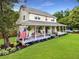Inviting home featuring a generous wrap-around porch with porch swing and well manicured landscaping at 2832 Old Villa Rica Rd, Powder Springs, GA 30127