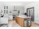 Spacious kitchen with stainless steel appliances, a large center island with cabinets, and sleek white cabinets at 2832 Old Villa Rica Rd, Powder Springs, GA 30127