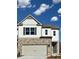 Charming two-story home with a stone-clad front and a two-car garage at 2464 Bayberry St, Acworth, GA 30101